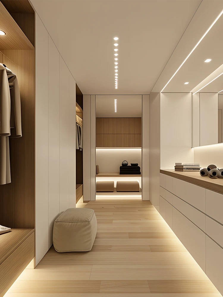 Bespoke luxury walk in closet design with modern wood tone custom wardrobe cabinets and sophisticated lighting.