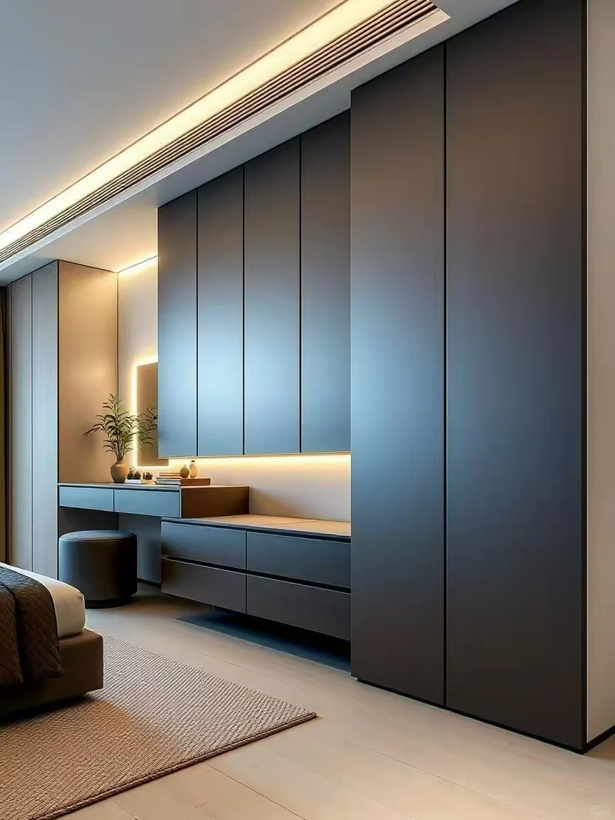 Bespoke matte grey wardrobe cabinets with soft-close mechanisms and hidden storage solutions for high-end residential projects.