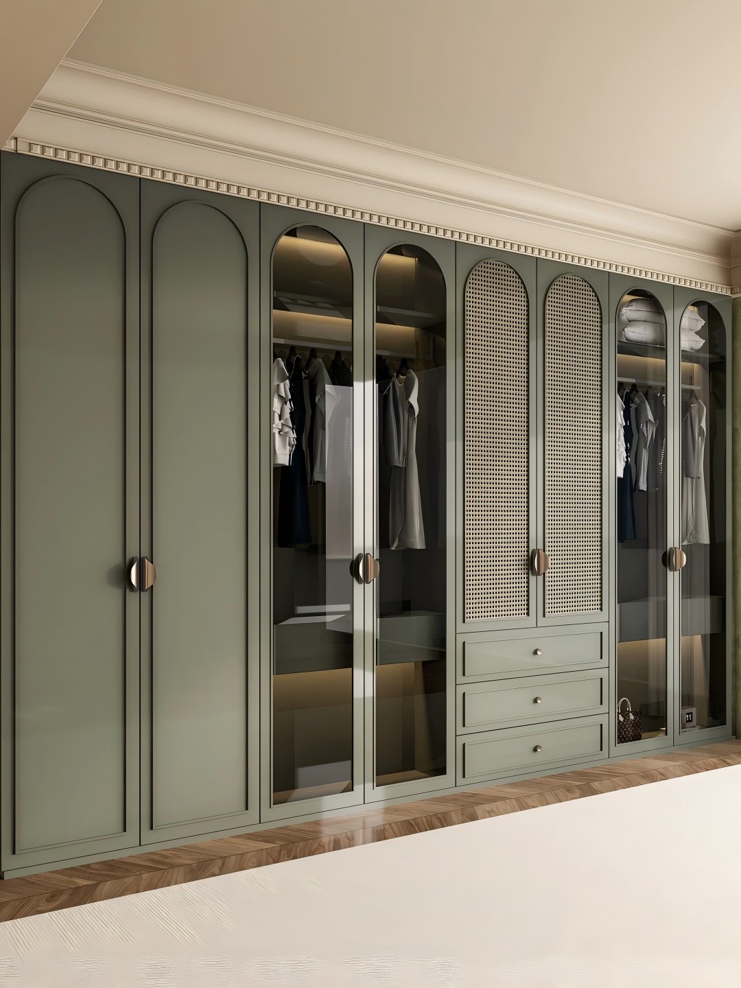 Luxury custom green wardrobe with closed doors and elegant arched design, modern bedroom clothing storage solution.