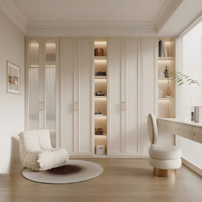 Beige built-in wardrobe with vanity desk and arched glass doors.